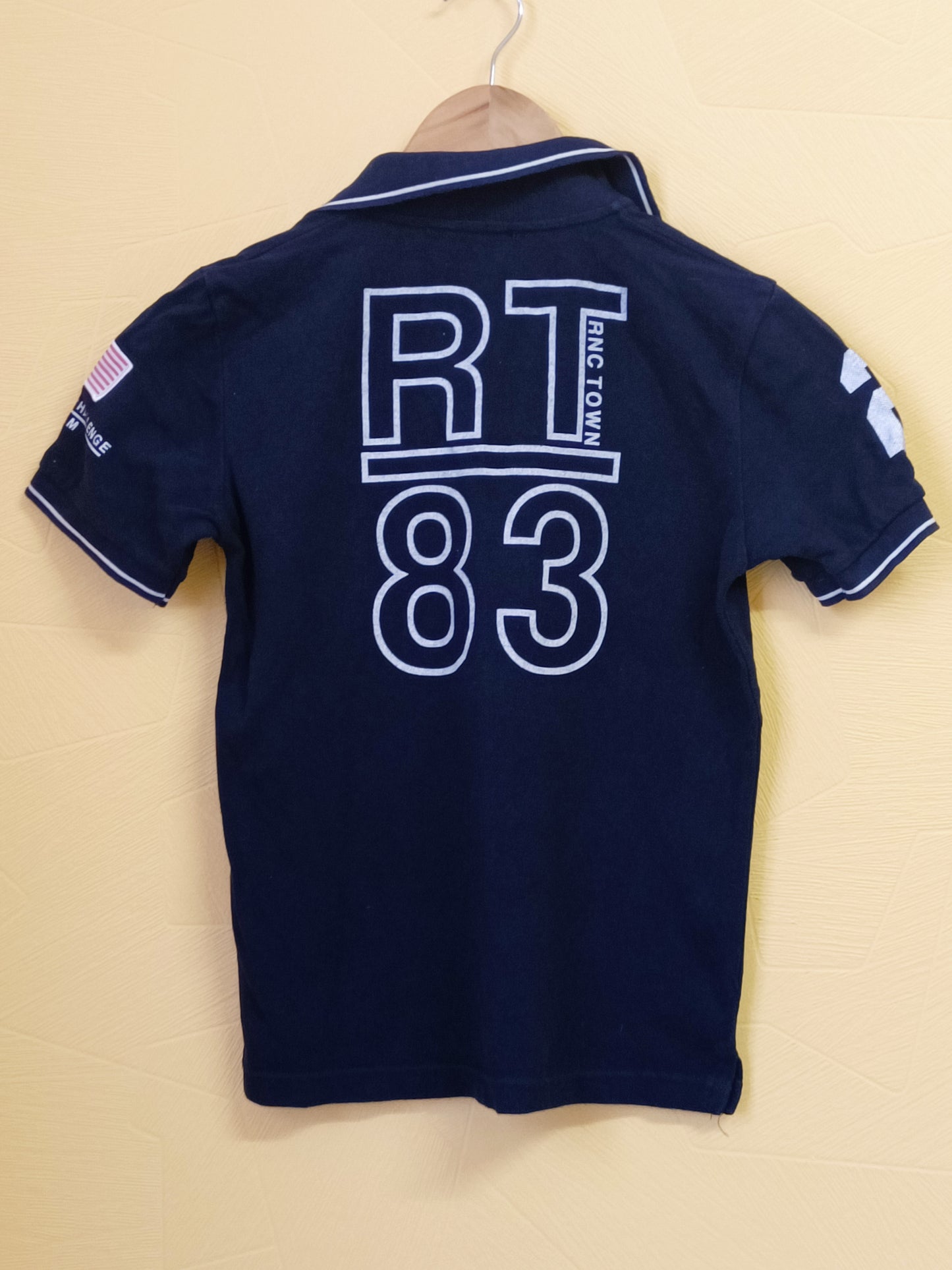 Polo bleu marine avec impression Taille 10 Ans