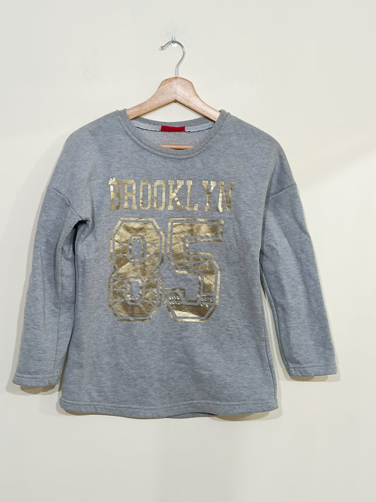 Sweat Heropilote gris avec écritures dorées Taille 12 Ans