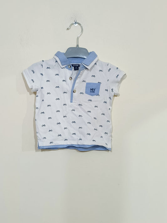 Polo Kiabi blanc avec motifs vélos Taille 9 Mois