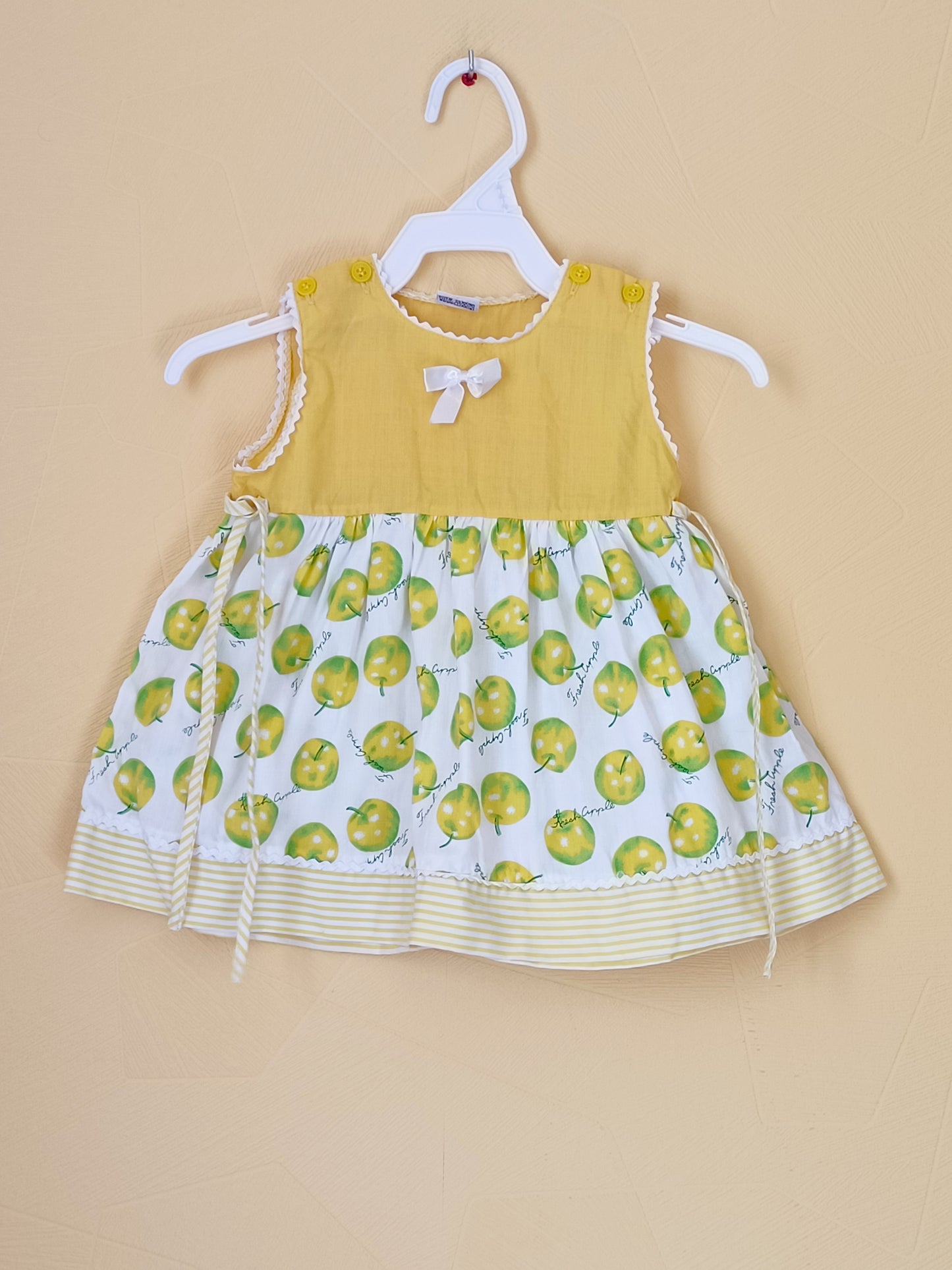 Robe sans manche jaune et imprimée Taille 6 Mois