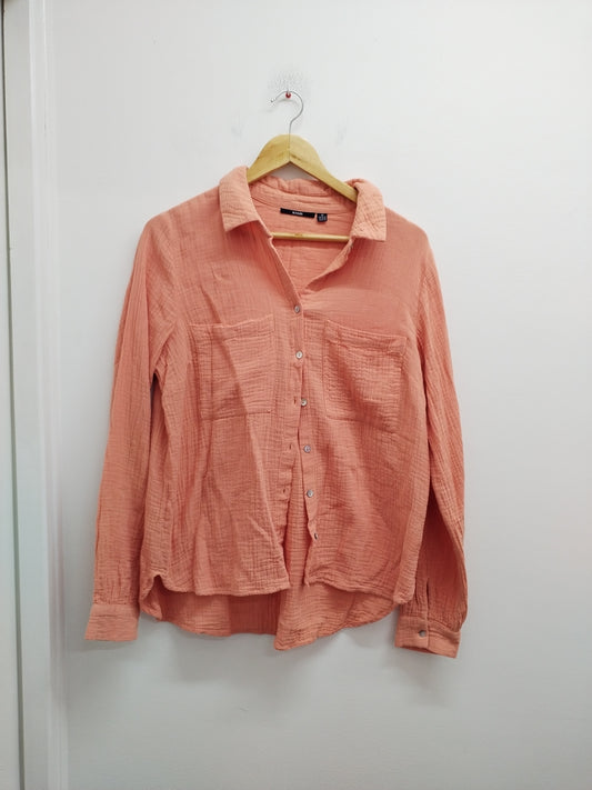 Chemise manches longues Kiabi saumon Taille M